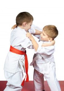 Two young athletes train judo sparring